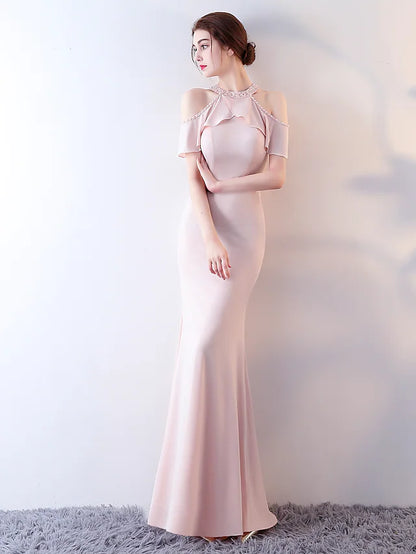 Back view of the blue halter short sleeve floor-length dress.
