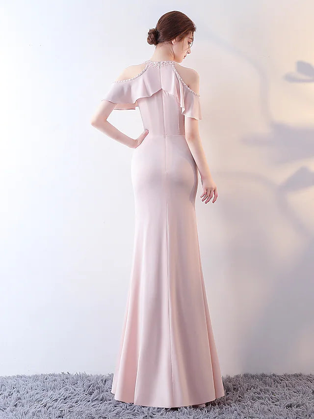 Side view of the elegant blue jersey dress, showing ruffles.