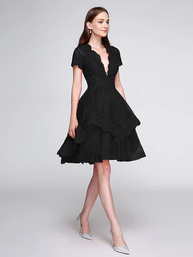 Back view of the ball gown dress showing appliques.