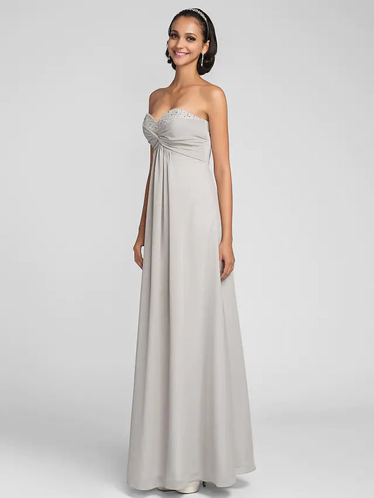 Elegant multi-color chiffon bridesmaid dress with open back and criss-cross detail.