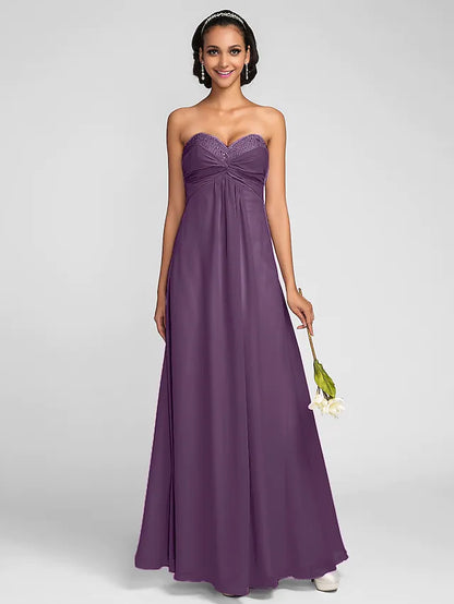 Back view of a multi-color chiffon bridesmaid dress featuring beading and open design.