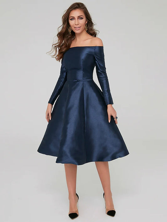 Woman wearing an elegant dark blue off-shoulder long sleeve satin knee-length dress with pleats.