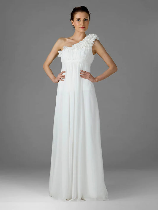 Woman wearing a light-colored one-shoulder floor-length chiffon bridesmaid dress with ruffles and draping.