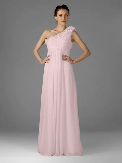 Back view of a woman wearing a one-shoulder floor-length chiffon bridesmaid dress.