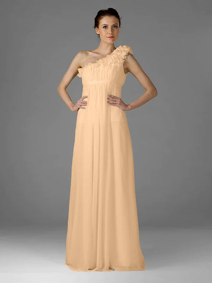 Close-up of the ruffled one-shoulder detail on a chiffon bridesmaid dress.