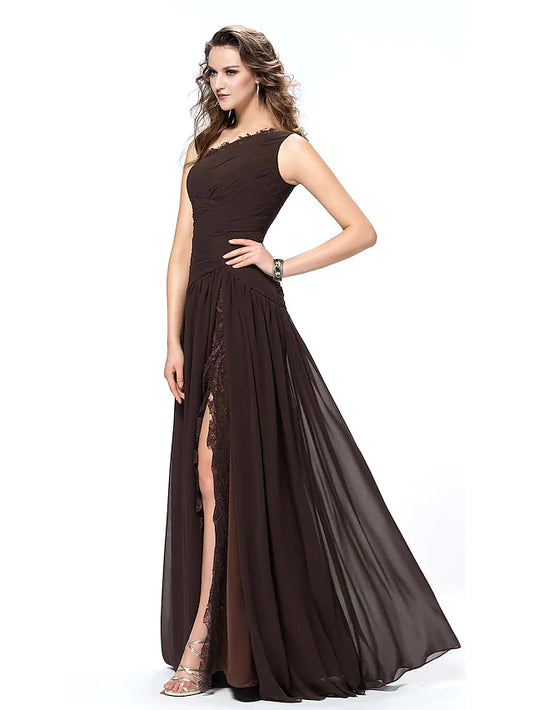 Woman wearing an elegant one-shoulder chiffon evening gown with a high slit and lace detail.