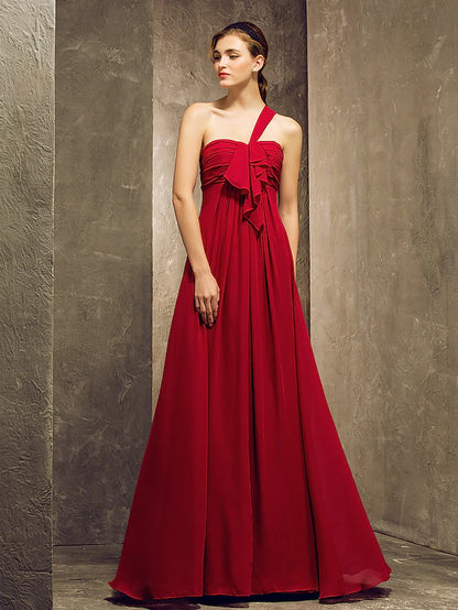 Woman in an elegant one-shoulder chiffon bridesmaid dress.