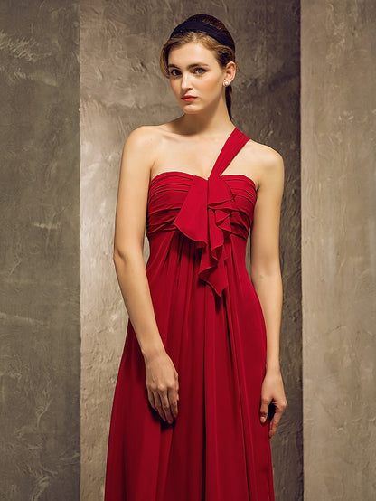 Back view of a woman wearing the one-shoulder ruched chiffon dress.
