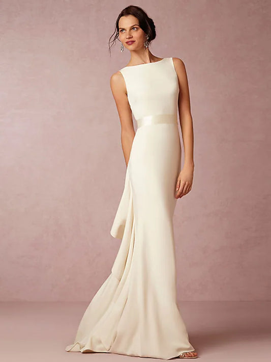 Front view of an elegant open back charmeuse wedding dress with a bateau neckline.