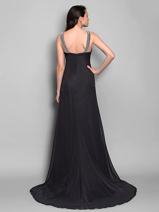 Back view of a model in a navy formal evening dress with open back.