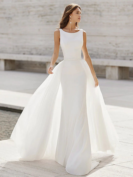 Elegant open back trumpet wedding gown with a court train.