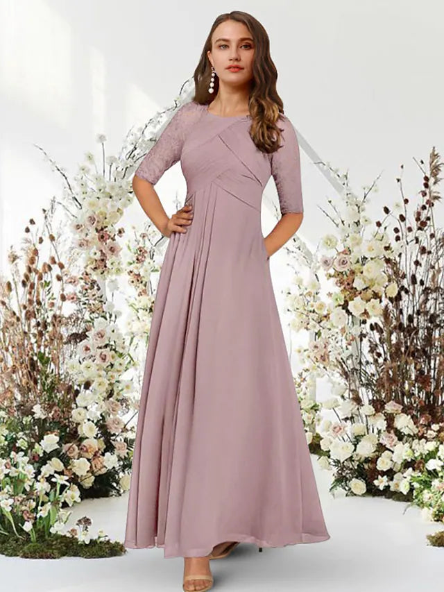 Elegant floor-length chiffon evening gown with half sleeves and jewel neck.