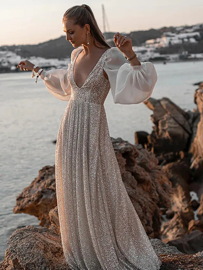 Elegant V-neck long sleeve sequined wedding dress with pleats.