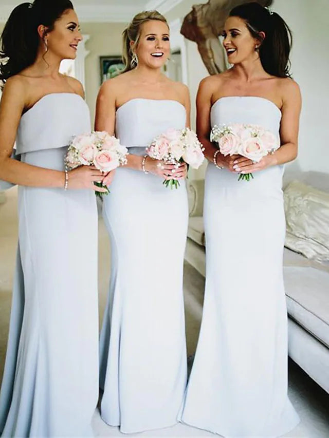 Full view of the elegant strapless bridesmaid gown, showcasing its sweep and ruffles.