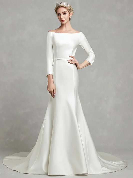Front view of a white strapless satin wedding dress with elegant pleats and a chapel length train.