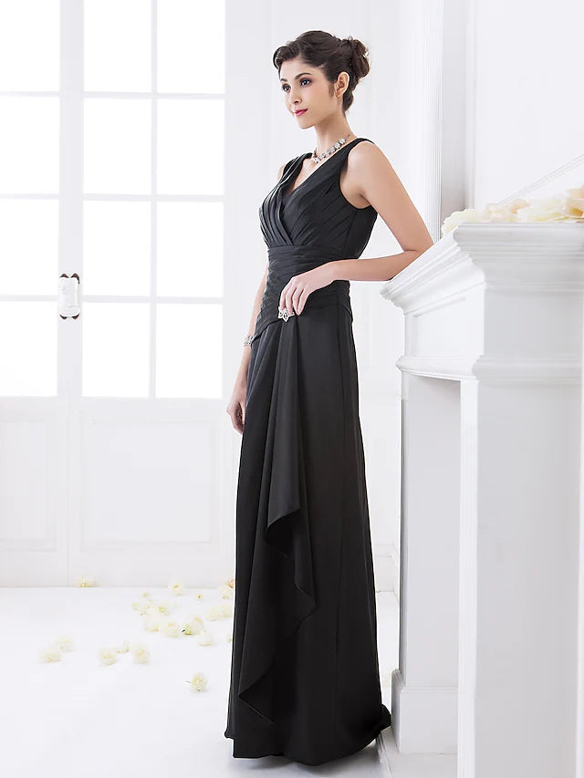Woman posing in a sophisticated V-neck stretch satin bridesmaid gown.