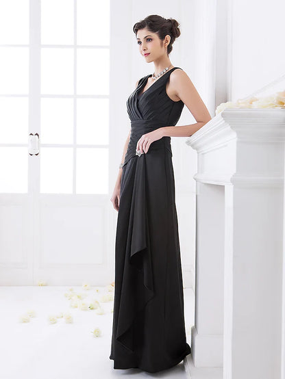 Woman posing in a sophisticated V-neck stretch satin bridesmaid gown.