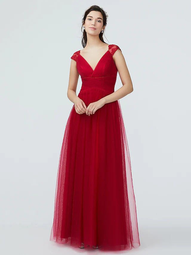 Back view of the floor-length A-line bridesmaid dress with lace and tulle details.