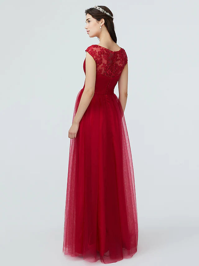 Side profile of a woman in the elegant V-neck short sleeve bridesmaid gown.