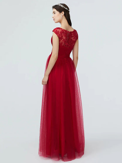 Side profile of a woman in the elegant V-neck short sleeve bridesmaid gown.