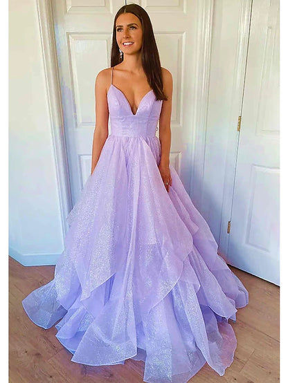 Sparkling A-Line prom dress with sweetheart neckline and floor-length tulle skirt.