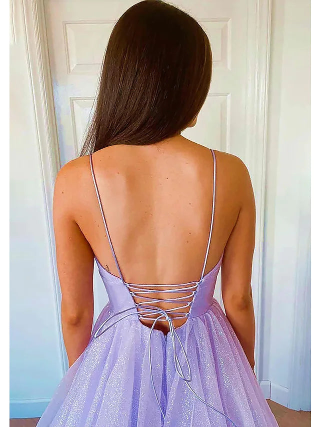 Elegant backless A-Line gown featuring pleats and ruffles, ideal for formal events.