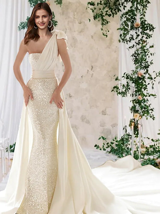 Sparkling sequin and satin one-shoulder mermaid wedding dress.
