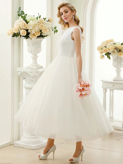Side view of the A-line tea-length wedding dress, showcasing its elegant silhouette.