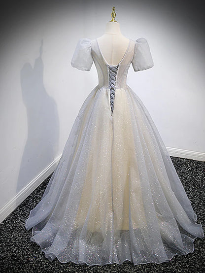 Side view of the elegant Quinceanera gown, showing the flowing tulle skirt.
